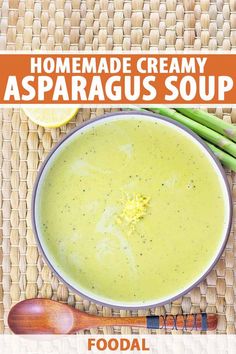 a bowl filled with asparagus soup on top of a table