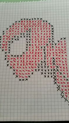 a cross stitch pattern with red and black stars in the shape of a speech bubble