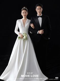 a man in a tuxedo standing next to a woman in a wedding dress