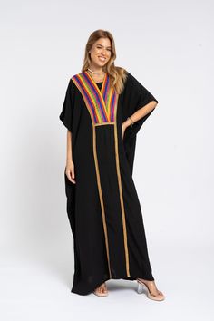 *Note : The kaftan in the video is a different color and is only displayed to show the fit, flow, and cut of the Kaftan. You will receive the one in the pictures.* A luxurious caftan with gold embroidery made of light mesh of linen and cotton, the fabric is unique in that it's very flowy and not the usual feel and touch of linen. This Kaftan is ideal to wear for any casual occasion. Whether taking a trip down the shopping lane, or home-based kitty parties, or about anything else, wearing this dress will make you feel classy and comfortable. Fabric : 50% Linen, 50% Polyester. Please note that the fabric on this Kaftan has some weight to it and is meant to give off that crumbled look. It's extremely breathable and made specifically for the African summer of Egypt so you feel like you're wear Festival Multicolor Embroidered Kaftan With Woven Motifs, Festival Kaftan With Multicolor Embroidery And Woven Motifs, Black Bohemian Style Festive Kimono, Long Black Bohemian Kurta, Festive Black Bohemian Kimono, Festive Bohemian Black Kimono, Bohemian Black Thobe In Tunic Style, Bohemian Black Thobe Tunic, Black Bohemian Tunic Thobe