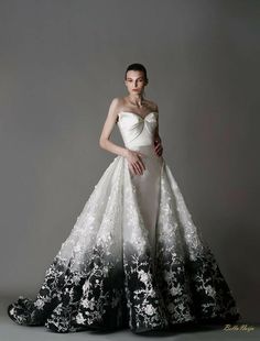 a woman in a white and black wedding dress