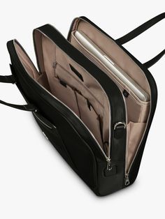 an open black bag with two compartments and zippers on the inside, sitting on a white surface