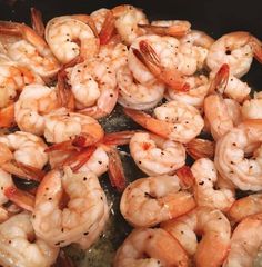 shrimp being cooked in a pan on the stove