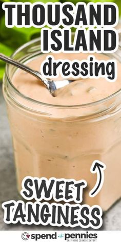 a jar filled with pudding sitting on top of a table next to a green plant