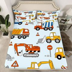 a bed with construction vehicles on it