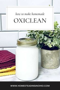 there is a jar with towels and a potted plant on the counter next to it that says how to make homemade oxiclean