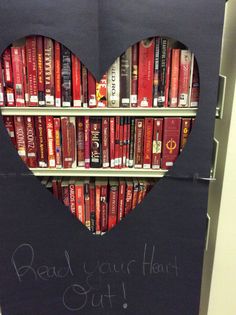 a heart shaped book shelf with books on it and the words read your heart out