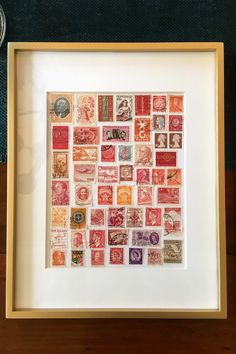 a framed photo with many different stamps on it