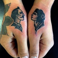 two people with tattoos on their hands