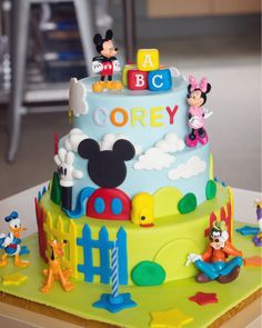 a mickey mouse birthday cake on a table