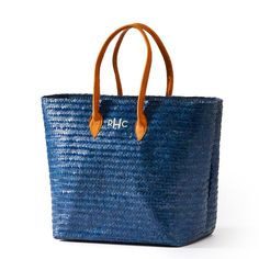 Handmade in Indonesia from woven palm leaf, this spacious tote is the perfect accessory for warm summer days and nights. Easy to carry with leather handles and roomy enough for all your beach essentials, the Palm Leaf Tote features a soft linen lining and an interior pocket to keep all your little essentials safe.    20"w x 8.5"d x 14"h  Woven from natural palm leaf with a soft linen lining and leather handles.  Due to the natural materials used to craft the bag, slight variations in color and t Beach Essentials, Traveling With Baby, Palm Leaf, The Palm, Leather Handles, Palm Leaves, School Days, Clothes Gift, Corporate Gifts