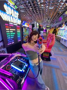 a woman taking a selfie in an arcade