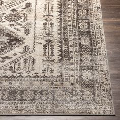 an area rug with brown and white colors