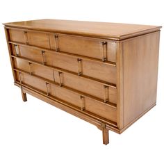 a wooden dresser with many drawers on it's sides and one drawer open to the side