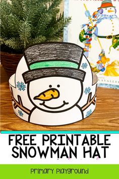 Snowman headband craft with a book and evergreen plant in the background, featuring a free printable offer. Snowman Mask For Kids, Sneezy Snowman Craft, Snow Hat Craft, Snowman Headband Craft For Kids, Snowman Day Activities, Snowman Dress Up Day At School, Snowman Craft Kindergarten, Snow Man Craft Preschool