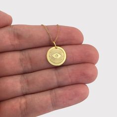 ● Material of pendant: Solid gold 14k ( REAL GOLD ) ● Metal Stamp: 14k ● The pendant is available in 3 sizes: - Small: 14,0 mm / 0,55 inches ( Diameter ) - Medium: 16,5 mm / 0,65 inches ( Diameter ) - Large: 19,1 mm / 0,75 inches ( Diameter ) ( In the photos the size is 14mm / 0.55 inches Diameter ) ● Material of chain: Solid gold 14k ( REAL GOLD ) It is thin and dainty and it is available in 4 sizes: - 40 cm / 15,75 inches ( Length ) - 45 cm / 17,72 inches ( Length ) - 50 cm / 19,68 inches ( Le Gold Evil Eye Necklace, Real Gold Chains, Evil Eye Necklace Gold, Eye Pendant, Evil Eye Pendant, Evil Eye Necklace, Necklace Personalized, Coin Necklace, Eye Necklace