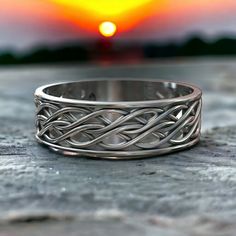 Viking Celtic Band Ring. 925 Sterling Silver. Norse Wedding rings. Thumb ring. Pagan Jewelry for men and women. A highly attractive Sterling Silver Celtic Ring, featuring a traditional design. Crafted in the finest Stamped 925 Sterling Silver, it will delight lovers of all things Celtic, and the unique history of the Celts and their influence on our lives today. Celtic design traditionally represents the interwoven nature of the human spirit. This band is ideal as a dress ring, or as a wedding band. A wedding band is a common Infinity knot symbolizing the eternal bond of marriage. The interlacing lines also represent compassion, wisdom and endless life. DETAILS: Ring Size: Please select the preferable ring size from drop-down on upper right. If there is no desired size available, convo us. Silver Promise Bands, Symbolic Promise Ring With Intricate Design, Symbolic Intricate Design Promise Ring, Silver Ring With Intricate Design, Silver Ring With Intricate Design And Round Band, Silver Rings With Intricate Design For Promise, Silver Promise Ring With Intricate Design, Norse Wedding, Rings With Meaning