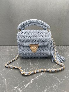 Tittle: Pale blue bag,cotton yarn purse,crochet capri pouch,crochet capri pouch, Women's Bag, gift for her, mothers day gift, Luxury Cotton Bag Strap - 100 cm Height: 18-20cm  Length: 22-23cm ✨FUNCTIONAL USE: Bags Planet bohemian purse has two different uses, both as a hand bag and as a crossbody bag. In the summer months, you can use this color bag according to the invitation you will attend by making a handbag. 🧼WASHING: It is not recommended to wash the Bags Planet yarn bag in the washing machine because the accessories are damaged after washing. It is recommended to clean it with a damp cloth. 🎁A UNIQUE GIFT: This unique knitted bag has a stylish look with its unique design. You can show your value to your loved ones by gifting this hobo bag to your loved ones on special occasions su Yarn Purse, Clutch Bag Tutorial, Recycled Handbag, Crochet Frock, Crochet Drawstring Bag, Pouch Crochet, Crochet Clutch Bags, Bohemian Purse, Purse Crochet