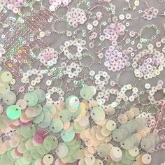 an image of buttons and sequins on fabric