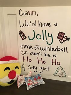 there is a sign on the wall that says we'd have a jolly time at winterball