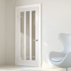 an egg chair in front of a white door