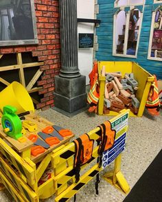 construction equipment sitting on the ground in front of a fire hydrant and building materials