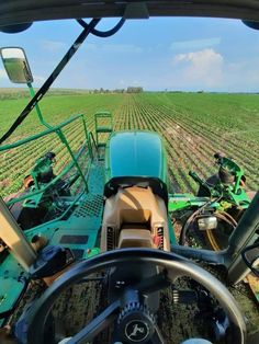 a tractor is driving in the middle of a field