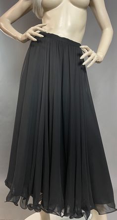 "Frank Usher Skirt | Black Chiffon Skirt | 90s Maxi Skirt I simply love Frank Usher designs - they are renowned for their flowing gowns, cocktail dresses and evening wear, producing some of the finest designs during the 50s, 60s and 70s. This striking skirt is no exception to the rule, team it with a bodysuit, jumper or T-shirt - it just makes an outfit! Easy breezy to allow for freedom of movement and complete comfort. An absolutely delicious addition to your wardrobe... (Please note jumper/bod Formal Full-length Lined Dress, Flowy Pleated Party Skirt, Formal Full-length Dress With Lined Skirt, Flowy Maxi Skirt For Gala, Elegant Lined Maxi Skirt For Prom, Elegant Flared Maxi Skirt For Prom, Flowy Lined Maxi Skirt For Prom, Evening Full-length Dress With Lined Skirt, Flowy Long Skirt For Prom Season