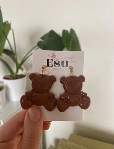 a pair of teddy bear shaped chocolate earrings