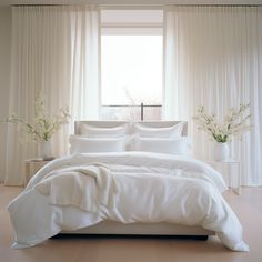 Beautiful bedroom featuring Hampton and Astley heavenly soft Egyptian cotton sateen bedding in pure white