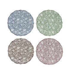 four plates with different designs on them