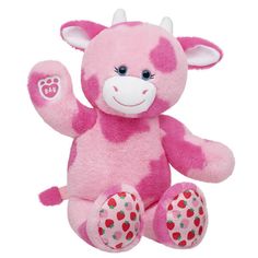 a pink and white stuffed animal with strawberrys on it