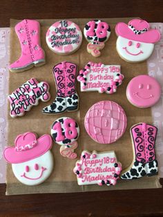 decorated birthday cookies in the shape of cowgirl boots