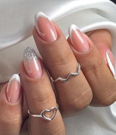 Embrace the clean girl aesthetic with these 25 simple and chic white nail ideas! Whether you prefer minimalistic charm or more elaborate designs, there's something for everyone. We just love these white French tip nails with silver glitter! Graduation Nails, Girls Nails, Stick On Nails, Prom Nails, French Tip Nails, Cute Acrylic Nails, Acrylic Nail Designs