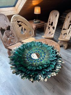 peacock feathers on top of wooden chairs in a room