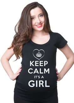 a pregnant woman wearing a t - shirt that says keep calm it's a boy