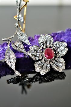 A Ladies Antique Silver Topped 14K Yellow Gold Flower Brooch Set With A 7.5 X 9.5 Mm Oval Ruby And 191 Diamonds Ranging From Old Mine Cut To Modern Brilliant Cut. The Total Weight Of All Diamonds Is 5.12 Carats. Rose Gold Mens Ring, Ruby Flower, Gold Lotus, Rose Gold Morganite, Diamond Fashion Rings, White Diamond Ring, Silver Tops, Key Pendant, Gold Flower