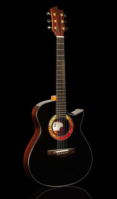 an acoustic guitar is shown against a black background