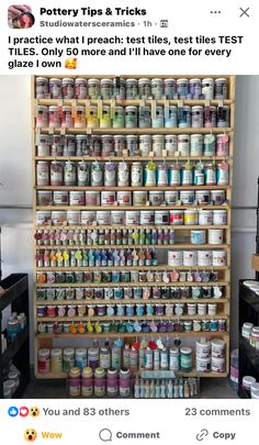 a shelf filled with lots of different types of paint