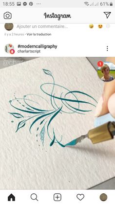 someone is drawing something on paper with blue ink