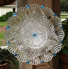 a clear glass dish sitting on top of a wooden table