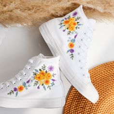 '' Custom Embroidered Converse High Tops, Lavender and Daisy and Sunflower Embroidered Wedding Shoes for Bride, Bridal Flowers Embroidered Wedding Sneakers, Converse Embroidery Floral, Wedding Gifts'' 🍀 Price includes Converse Shoes and Floral Embroidery Designs as shown 🍀 🍀 Shoe Type: Converse 1970s 🍀 Shoe color: 23. Full White 1. DETAILS 🍀 You can send me your Converse, Vans, canvas shoes or I can buy them for you. Custom-ordered embroidered Vans and Converse shoes, please wait another 2-4 days. Each pair is hand embroidered to order, please make sure you put in the correct shoe size before you check out. The embroidery is meticulous and does not fade. 🍀 You will receive Vans and Converse shoes with floral embroidery designs as above. 2. PERSONAL EXPRESSION 🍀 Create your unique vi White Sneakers With Appliques For Summer, Spring Wedding Embroidered Sneakers, White High-top Sneakers With Floral Embroidery, White Embroidered Sneakers For Summer, Wedding Low-top Sneakers With Floral Embroidery, White Embroidered Sneakers For Spring, White Embroidered Lace-up Sneakers, Embroidered Sneakers For Wedding, Converse Sunflower