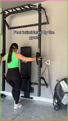 a woman is doing squats in front of a gym machine with the caption, feel intimateed by the gym?