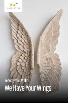 a white angel wings with the words beauty your walls we have your wings