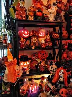 a shelf filled with lots of halloween decorations