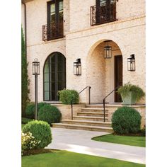 the front entrance to a large house with steps leading up to it