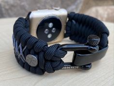 "FREE USPS PRIORITY MAIL SHIPPING FOR DOMESTIC US ORDERS (Includes U.S. Military APO/FPO Address Overseas) Thank you for visiting our shop \"Cording 2U\". A veteran owned business. Handcrafted Paracord wearables customized \"According To You\". Handcrafted with 100% Nylon Paracord \"MADE IN USA\" Our Products include: 🔹Custom handcrafted watch bands according to your wrist size, style, and color of choice. If you don't see it in our page yet, please contact us and we can discuss your options. ? Adjustable Black Apple Watch Band For Outdoor, Adjustable Black Watch Bands With Custom Hardware, Black Paracord Bracelet Strap Watch Band, Custom Black Watch Bands For Outdoor, Custom Black Outdoor Watch Bands, Customizable Custom Watch Accessories For Everyday Use, Adjustable Durable Black Apple Watch Band, Custom Black Watch Accessories For Outdoor, Customizable Black Watch Accessories For Outdoor