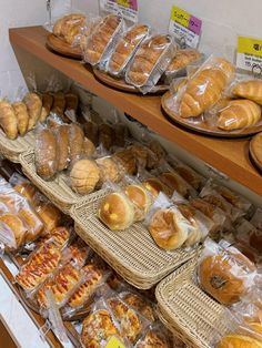 breads and pastries on display in a bakery