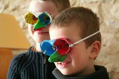 two young boys wearing sunglasses made to look like fish