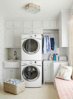 a washer and dryer in a small room